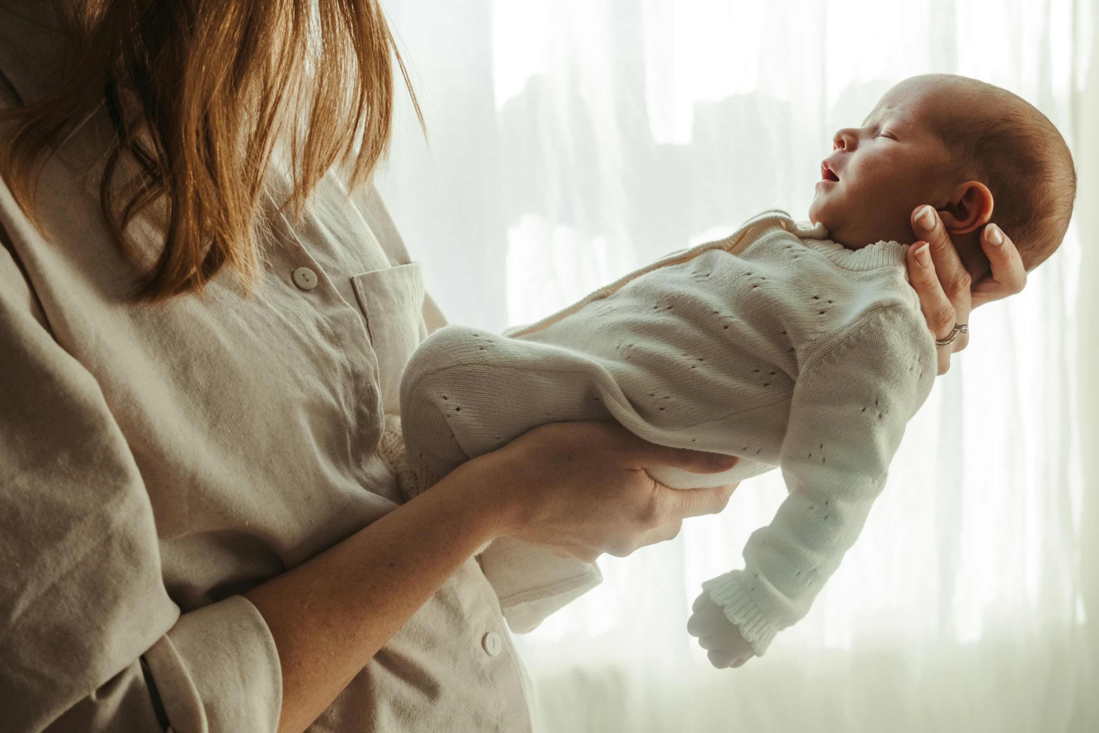 Mother holding her newborn baby